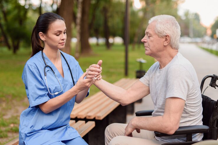 nurse examines wrist elderly patient 85574 6892